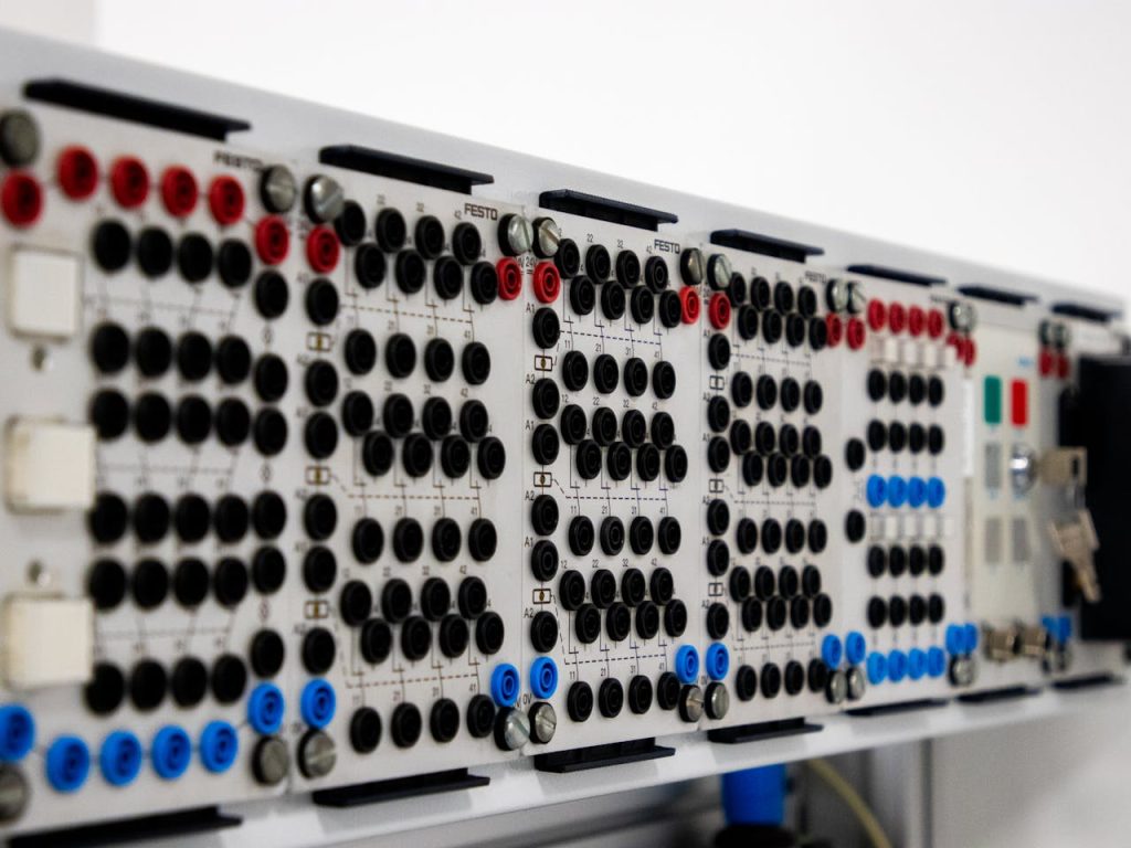 The Art of Drawing Readers In: Your attractive post title goes here Detailed image of a modern industrial control panel featuring multiple connectors and buttons.