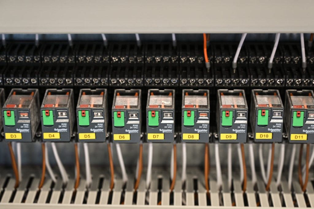 Crafting Captivating Headlines: Your awesome post title goes here Close-up view of electrical relays in an industrial panel box showcasing circuit components.